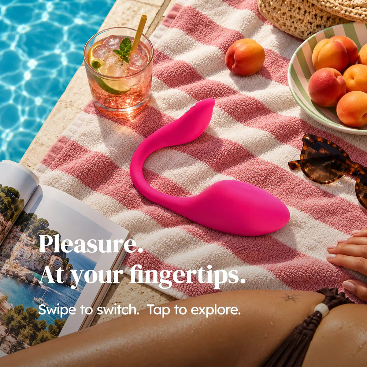 TOENDI ElixirEgg pink wearable vibrator displayed on a picnic blanket beside a swimming pool.